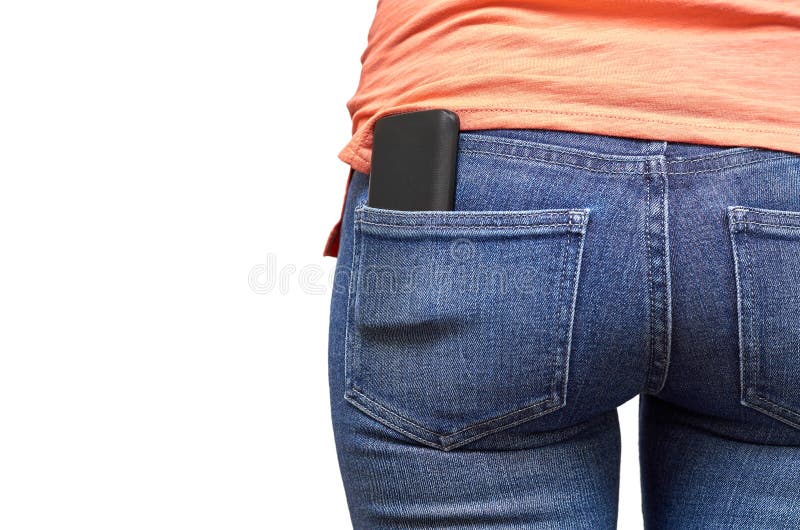 Telefone celular em um bolso da calças de ganga Isolado no fundo branco imagem de stock Telefone celular em um bolso da calças de ganga Isolado no fundo branco imagem de stock