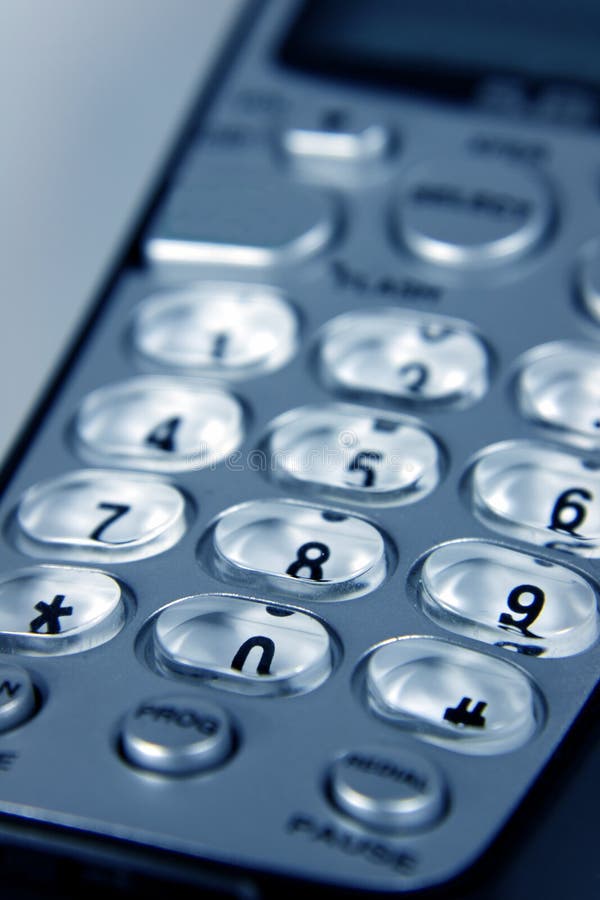 A close-up cordless telephone pad. A close-up cordless telephone pad.