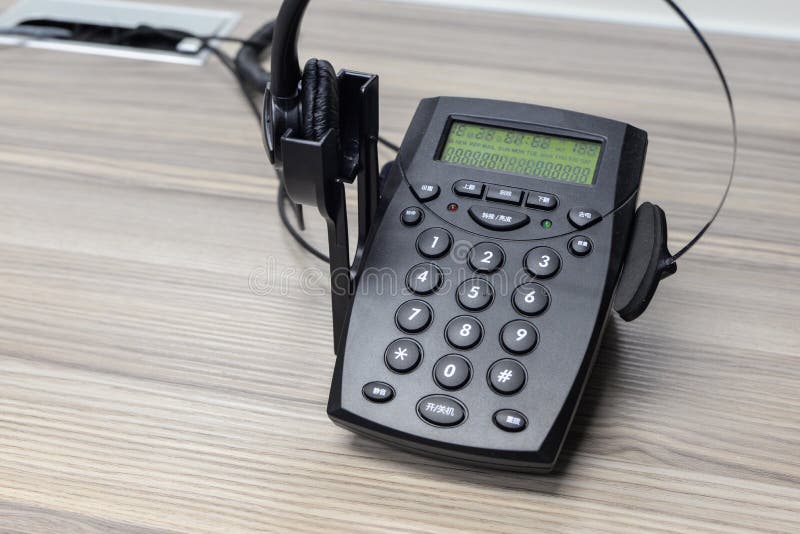 Telefono e cuffia avricolare fotografie stock Telefono e cuffia avricolare fotografie stock