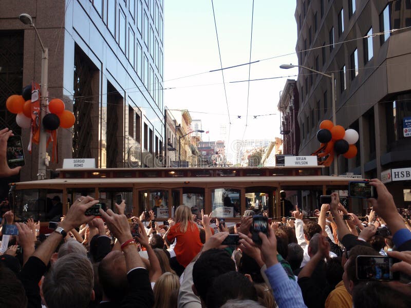 SAN FRANCISCO, CA - NOVEMBER 3: During Giants Parade Cable Car with Sergio Romo and Brian Wilson rolls down the street as people take photos and cheer Nov. 3, 2010 San Francisco, CA. SAN FRANCISCO, CA - NOVEMBER 3: During Giants Parade Cable Car with Sergio Romo and Brian Wilson rolls down the street as people take photos and cheer Nov. 3, 2010 San Francisco, CA.