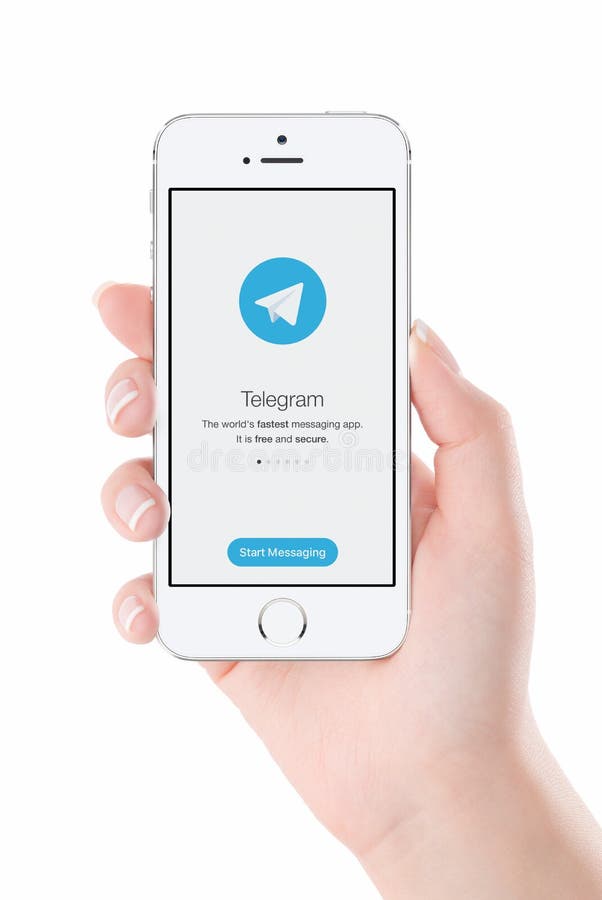 Telegram messenger launch screen on iPhone smartphone display in female hand