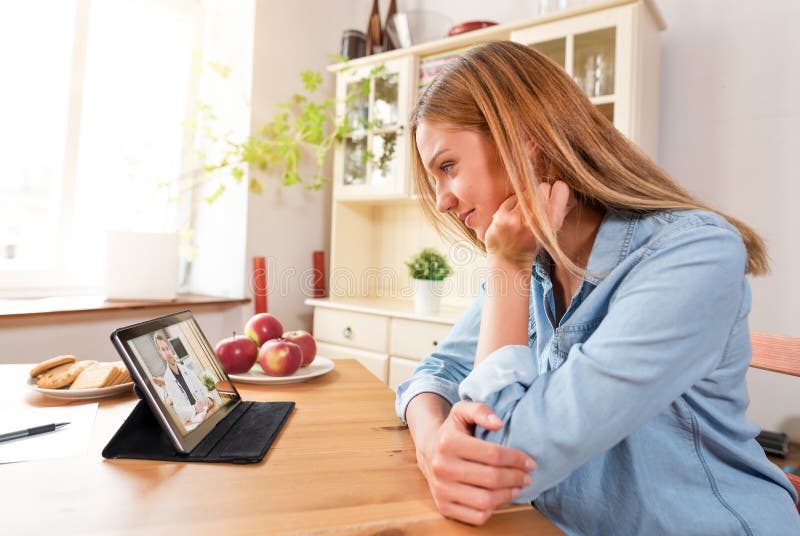 Telehealth concept with doctor on tablet screen