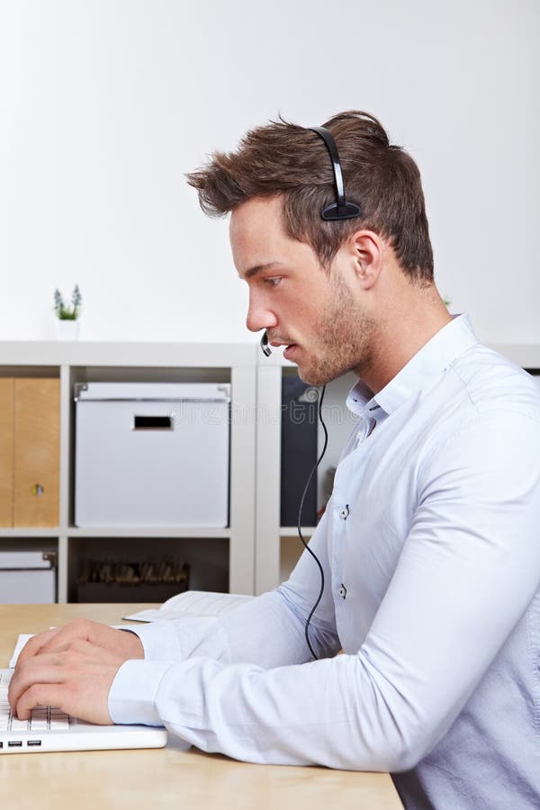 Telemarketing employee with headset royalty free stock photo Telemarketing employee with headset royalty free stock photo