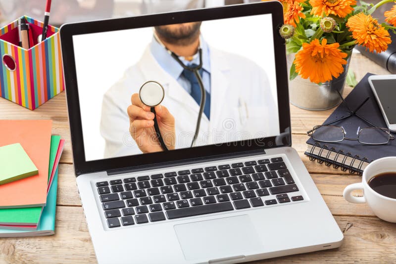 Doctor GP on a computer screen, office desk background stock photography
