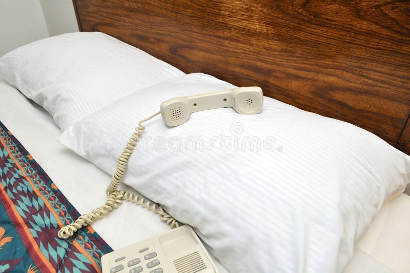 Telephone on bed pillow