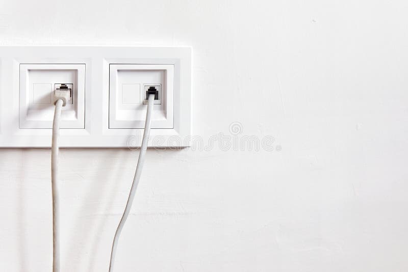 Internet Blue Cable Plug Into The White Network Outlet Against White Wall  Stock Photo, Picture and Royalty Free Image. Image 88855207.