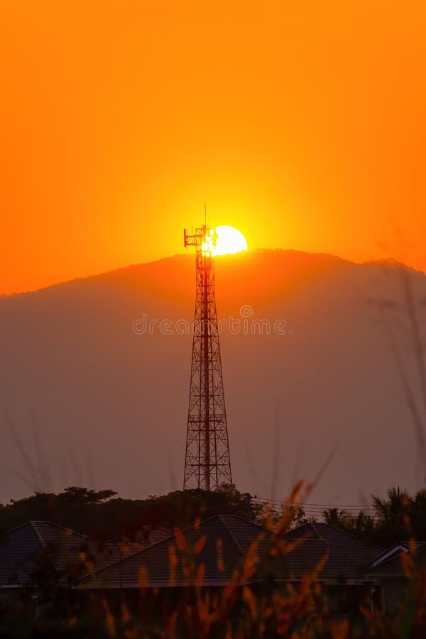 Telephone tower, radio tower during sunset. Telecommunication Tower for 2G 3G 4G 5G network, Cellular phone antenna, BTS, microwave, repeater, base station, IOT.