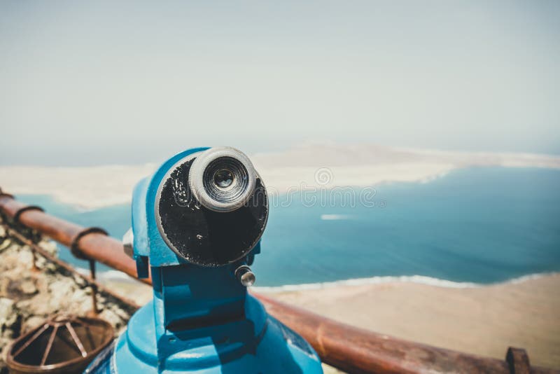 Telescope in Mirador del Rio viewpoint. Telescope and panoramic view at La Graciosa Island from Mirador del Rio viewpoint royalty free stock photos Telescope in Mirador del Rio viewpoint. Telescope and panoramic view at La Graciosa Island from Mirador del Rio viewpoint royalty free stock photos