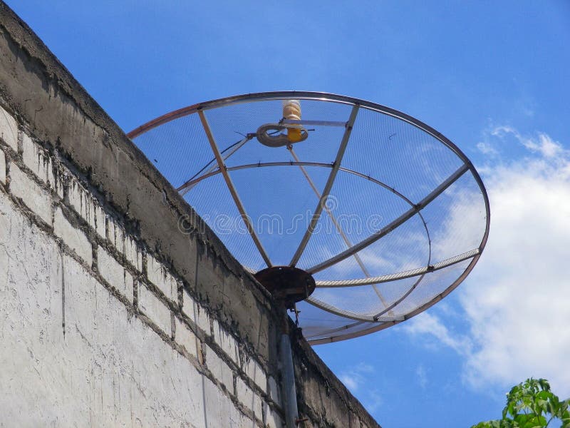 Television Satellite Dish Installed Above the House Stock Photo Image
