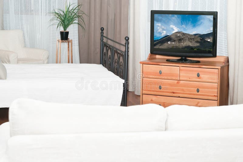 Television set in bedroom stock image. Image of home 18616547