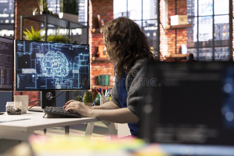 Teleworking developer using computer for artificial intelligence computing stock image