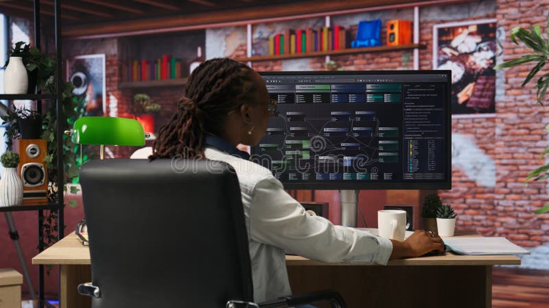 Teleworking programmer using computer for artificial intelligence developing stock photos