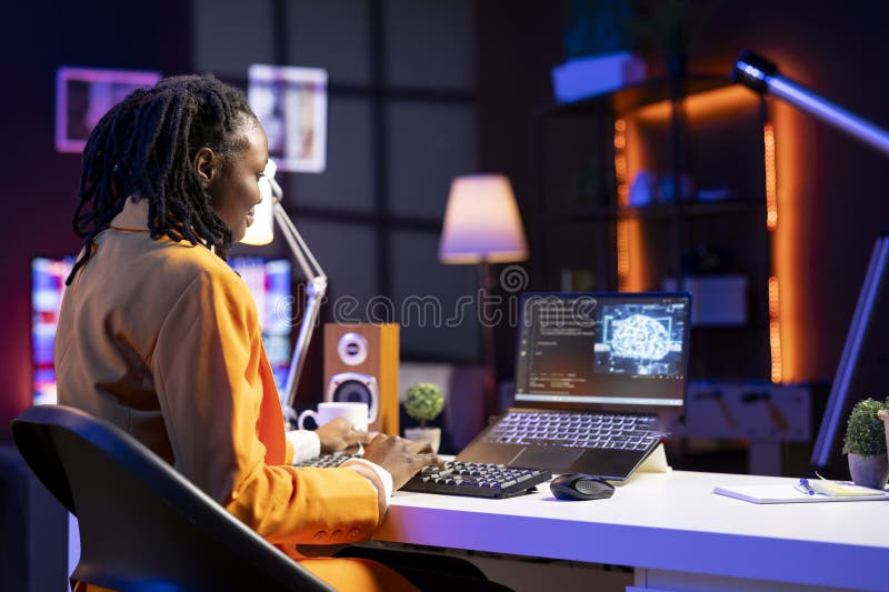 Teleworking programmer using laptop for artificial intelligence computing stock photos