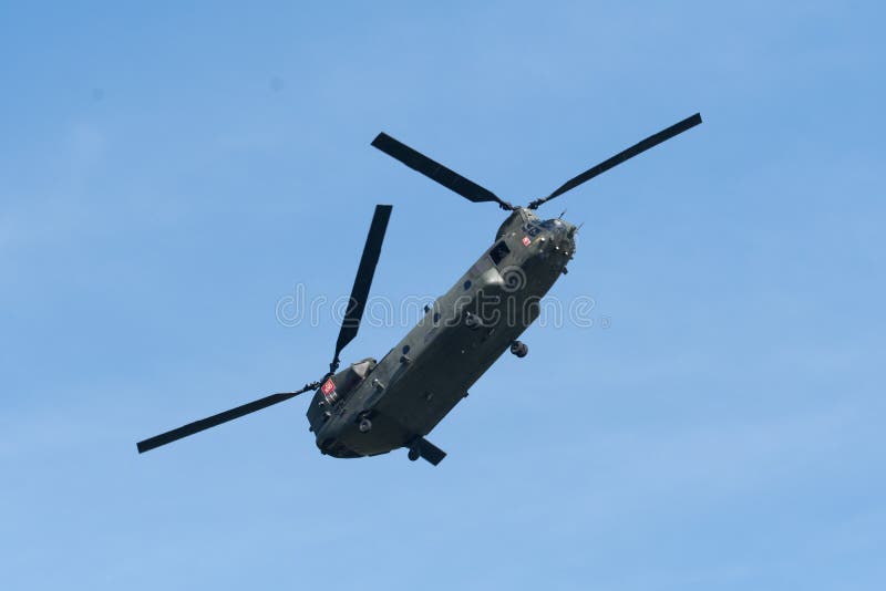 A solo RAF Boeing Chinook twin rotor helicopter