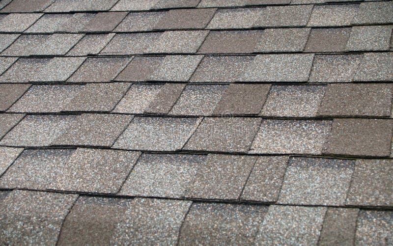 A newly installed composition shingle roof close up. A newly installed composition shingle roof close up.