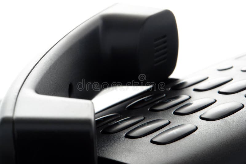 Teléfono fijado a mano sobre telclado numérico imagen de archivo Teléfono fijado a mano sobre telclado numérico imagen de archivo