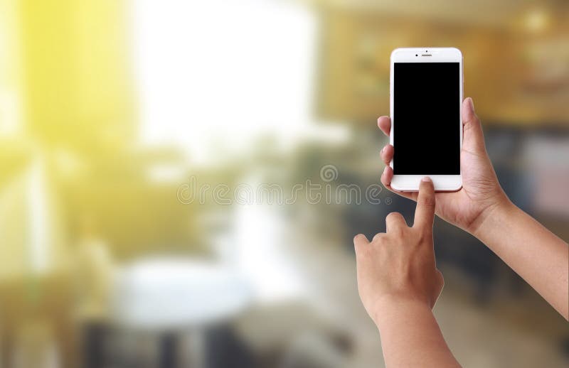 Teléfono móvil del uso humano de la mano imagen de archivo libre de regalías Teléfono móvil del uso humano de la mano imagen de archivo libre de regalías