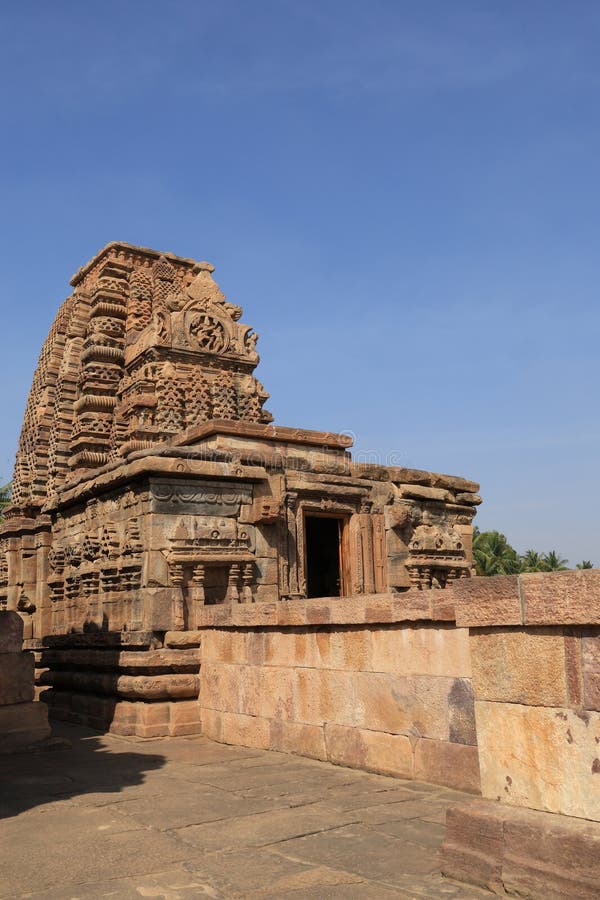 Pattadakal, also called Raktapura, is a complex of 7th and 8th century CE Hindu and Jain temples in northern Karnataka, India. Located on the west bank of the Malaprabha River in Bagalkot district, this UNESCO World Heritage Site[1][2] is 23 kilometres (14 mi) from Badami and about 9.7 kilometres (6 mi) from Aihole, both of which are historically significant centres of Chalukya monuments.[3][4] The monument is a protected site under Indian law and is managed by the Archaeological Survey of India. Pattadakal, also called Raktapura, is a complex of 7th and 8th century CE Hindu and Jain temples in northern Karnataka, India. Located on the west bank of the Malaprabha River in Bagalkot district, this UNESCO World Heritage Site[1][2] is 23 kilometres (14 mi) from Badami and about 9.7 kilometres (6 mi) from Aihole, both of which are historically significant centres of Chalukya monuments.[3][4] The monument is a protected site under Indian law and is managed by the Archaeological Survey of India