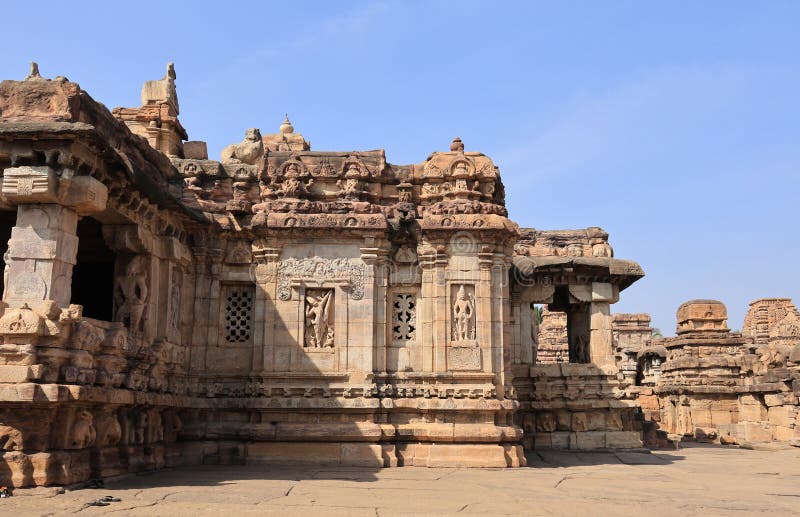 Pattadakal, also called Raktapura, is a complex of 7th and 8th century CE Hindu and Jain temples in northern Karnataka, India. Located on the west bank of the Malaprabha River in Bagalkot district, this UNESCO World Heritage Site[1][2] is 23 kilometres (14 mi) from Badami and about 9.7 kilometres (6 mi) from Aihole, both of which are historically significant centres of Chalukya monuments.[3][4] The monument is a protected site under Indian law and is managed by the Archaeological Survey of India. Pattadakal, also called Raktapura, is a complex of 7th and 8th century CE Hindu and Jain temples in northern Karnataka, India. Located on the west bank of the Malaprabha River in Bagalkot district, this UNESCO World Heritage Site[1][2] is 23 kilometres (14 mi) from Badami and about 9.7 kilometres (6 mi) from Aihole, both of which are historically significant centres of Chalukya monuments.[3][4] The monument is a protected site under Indian law and is managed by the Archaeological Survey of India