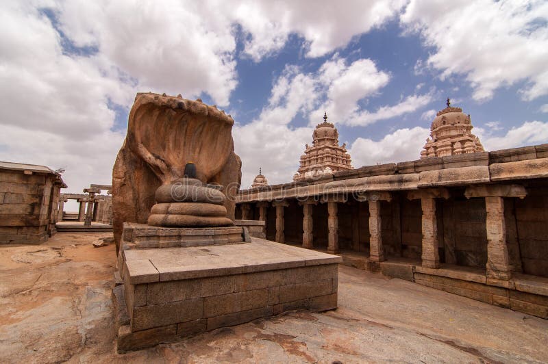 The Veerabhadra Swamy temple in Lepakshi, AP is an ancient temple built during the days of Vijayanagar empire. It was built in the 16th century by Veeranna and Virupanna, the then Vijayanagara governors of Penukonda. Seen here is the monolith Nagalingeshwara carved out of a huge boulder. The Veerabhadra Swamy temple in Lepakshi, AP is an ancient temple built during the days of Vijayanagar empire. It was built in the 16th century by Veeranna and Virupanna, the then Vijayanagara governors of Penukonda. Seen here is the monolith Nagalingeshwara carved out of a huge boulder.