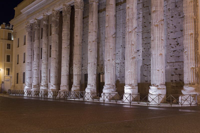 Part of a surving wall on from the Temple of Hadrian in Rome at night. Part of a surving wall on from the Temple of Hadrian in Rome at night