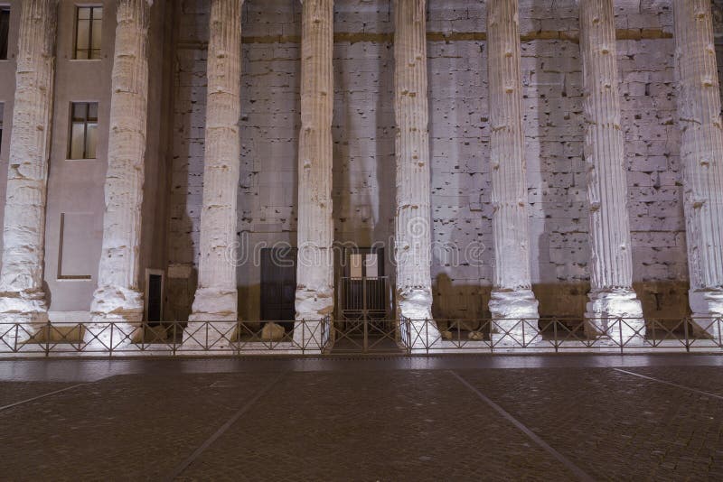 Part of a surving wall on from the Temple of Hadrian in Rome at night. Part of a surving wall on from the Temple of Hadrian in Rome at night