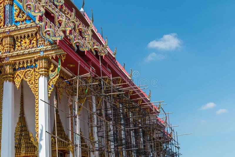 Temple roof vintage Thai style with against blue sky background