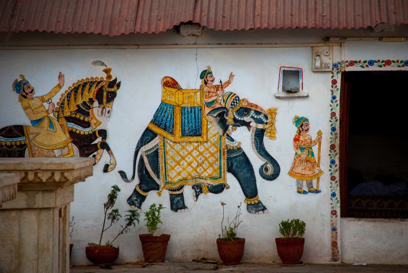 The old stone temple. Fragments of walls, the picture on the wall - painting. Udaipur, India. The old stone temple. Fragments of walls, the picture on the wall - painting. Udaipur, India