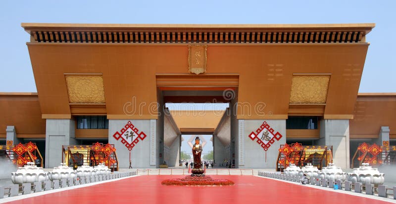 Famen Temple, Famen Town, Shaanxi Province, China: The entrance gate to the new complex at the Famen Temple with the huge Namaste Dagoba in the distance behind the statue. Famen Temple, Famen Town, Shaanxi Province, China: The entrance gate to the new complex at the Famen Temple with the huge Namaste Dagoba in the distance behind the statue.