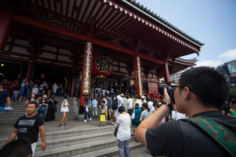 Nakamise shopping street in Asakusa, Tokyo. The busy arcade connects Senso-ji Temple to it's outer gate Kaminarimon, which can just be seen in the distance. Nakamise shopping street in Asakusa, Tokyo. The busy arcade connects Senso-ji Temple to it's outer gate Kaminarimon, which can just be seen in the distance