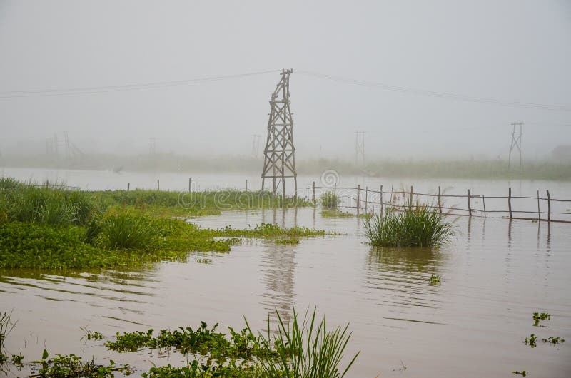 Atmospheric image of telegraph poles and floating houses in Inle Lake. Atmospheric image of telegraph poles and floating houses in Inle Lake