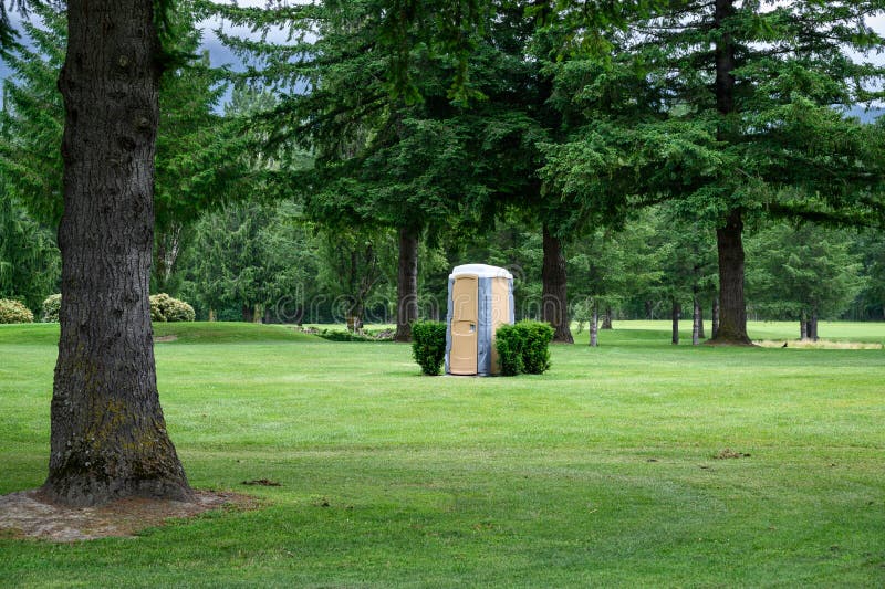 Temporary Plastic Outhouse in a Park Like Setting Stock Image Image