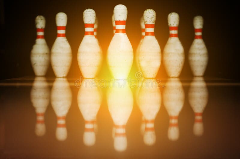 Ten White Pins in a Bowling Alley with Ball Hit Stock Photo Image of