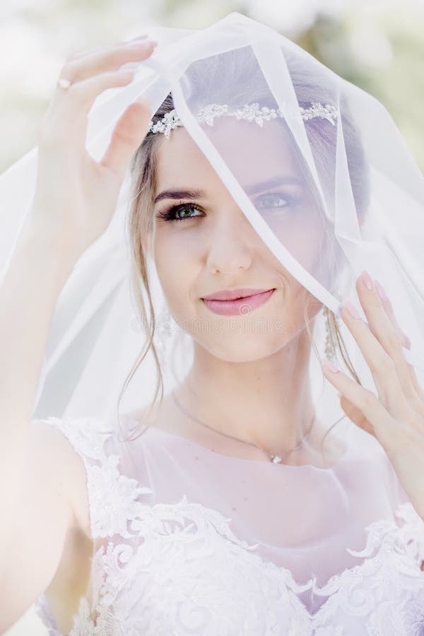 Tender bride in veil