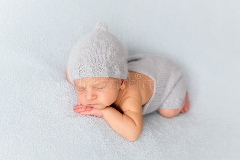 Tender newborn sleeping on belly royalty free stock photo Tender newborn sleeping on belly royalty free stock photo
