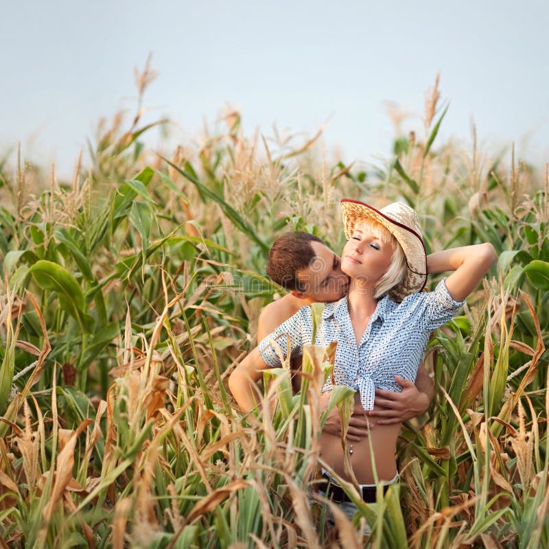 Tenderness in a cornfield, cowboy hats