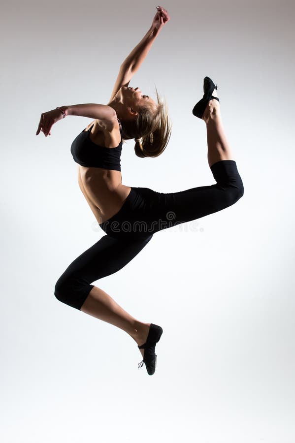 Tenderness, grace, melody and plastic of gymnastic girl. Grace jump in the air of nice young girl