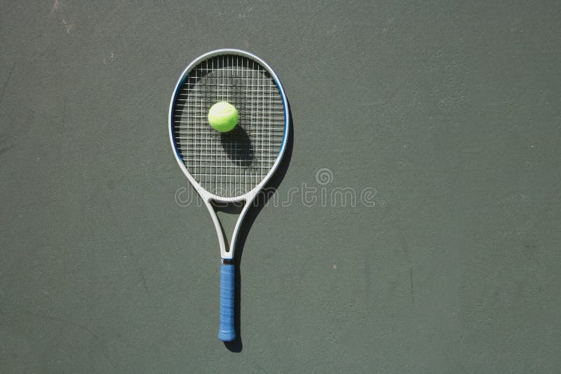 Pro tennis racket with ball on court