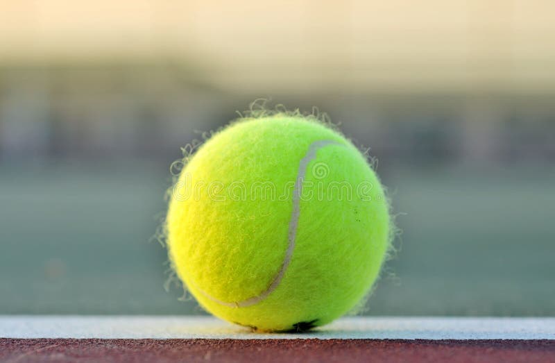 Tennis Ball on baseline of court