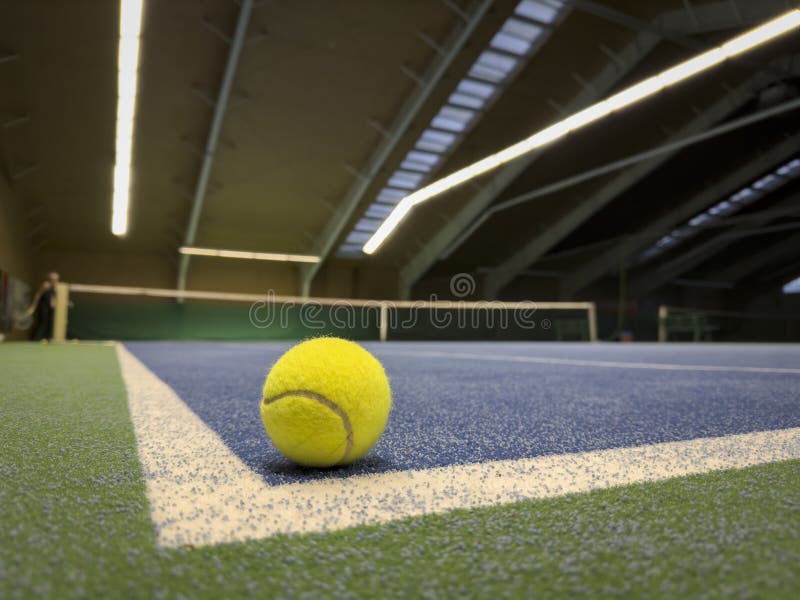 Tennis Ball is in Corner of Artificial Turf Tennis Court Stock Photo Tennis Ball is in Corner of Artificial Turf Tennis Court Stock Photo