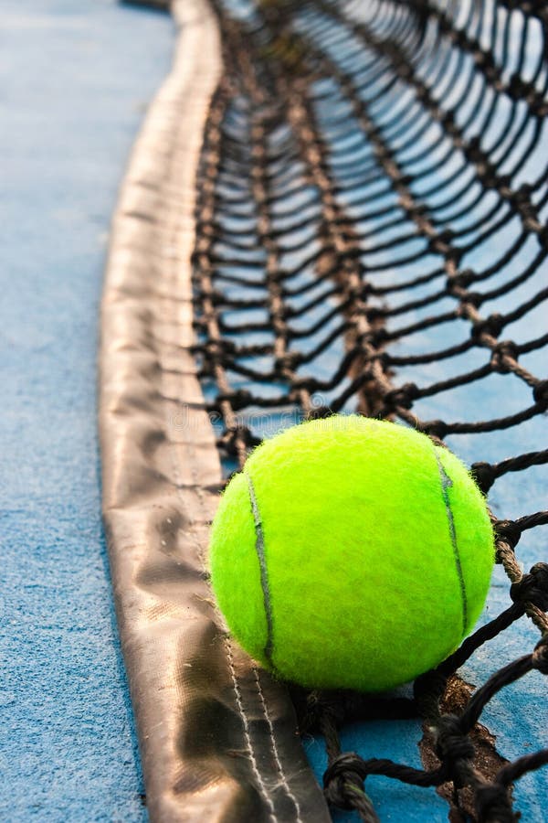 Tennis ball on the net stock image. Image of outdoors 30852335