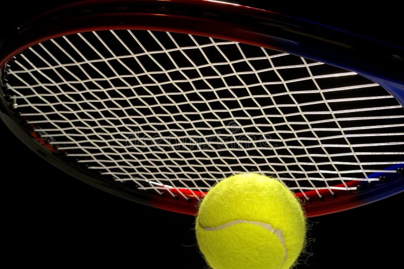 Yellow tennis ball and racket over black