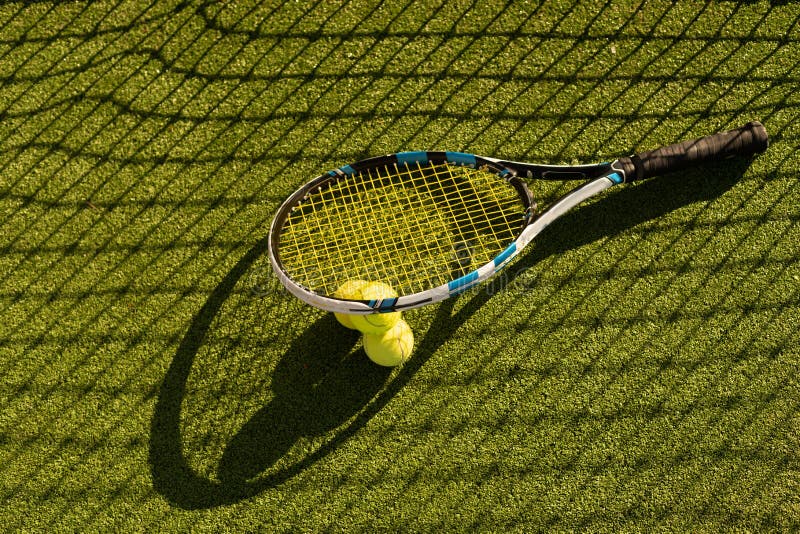 Tennis Ball with Racket on the Racket in Tennis Court Stock Image ...