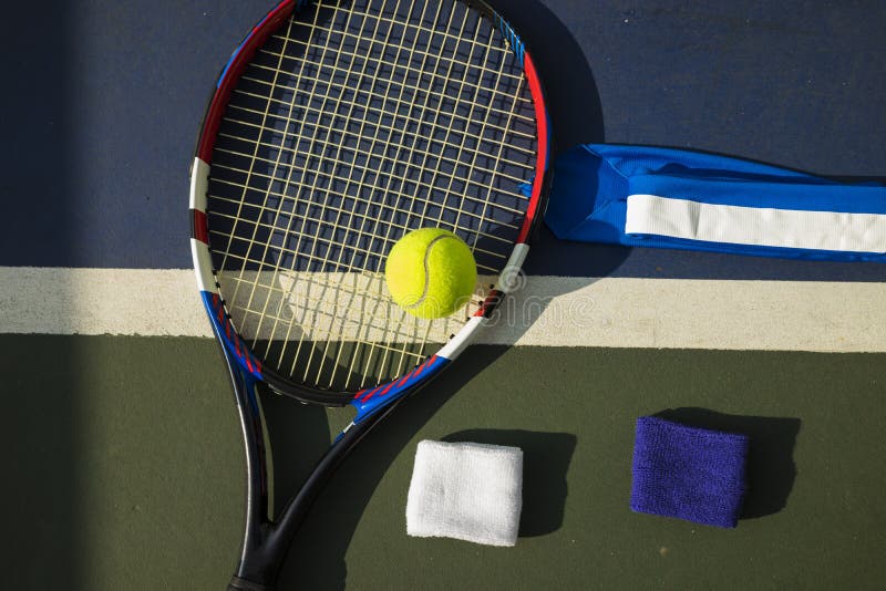 Tennis ball, racket, wristbands on tennis court royalty free stock images Tennis ball, racket, wristbands on tennis court royalty free stock images