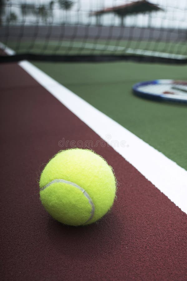 Tennis ball and racquet on Court royalty free stock images Tennis ball and racquet on Court royalty free stock images