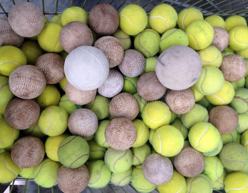 Tennis ball with softball stock image. Image of yellow 50159921