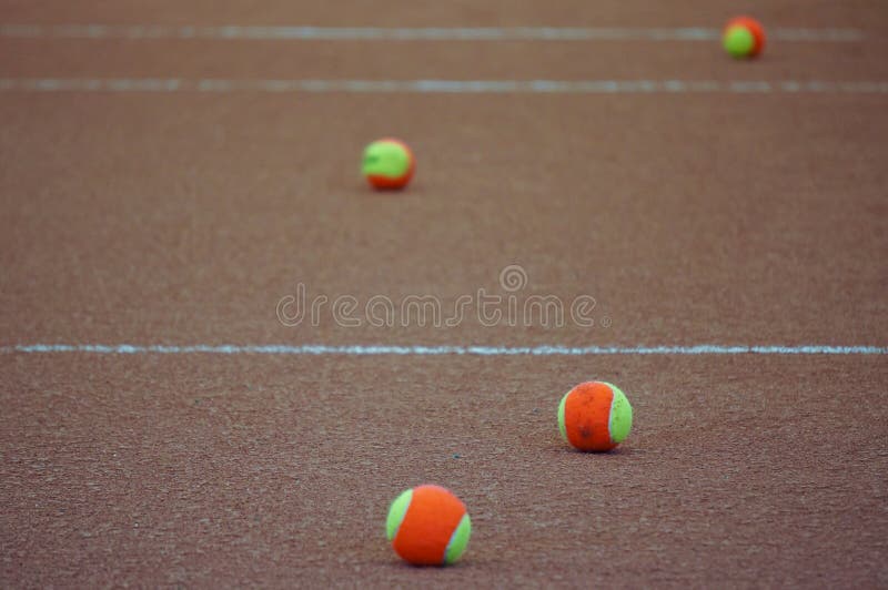 Tennis balls on clay court