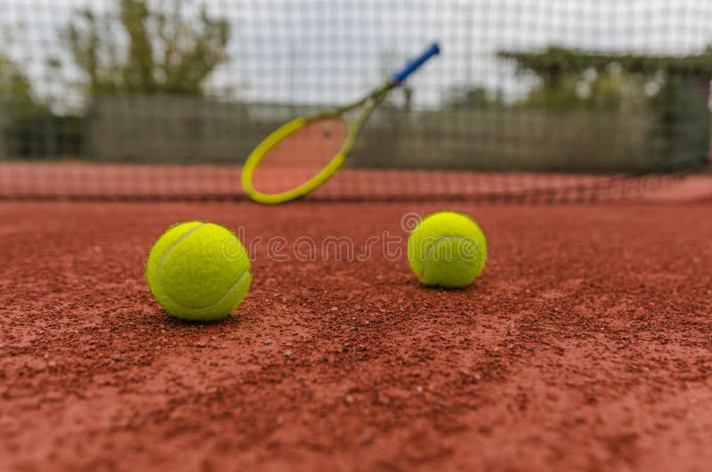 Tennis balls on court