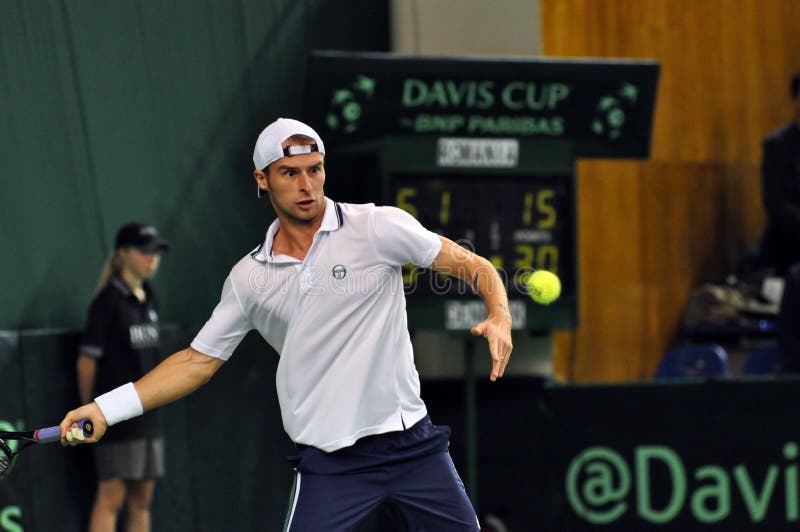 Tennis man Adrian Ungur in action at a Davis Cup match stock photos Tennis man Adrian Ungur in action at a Davis Cup match stock photos