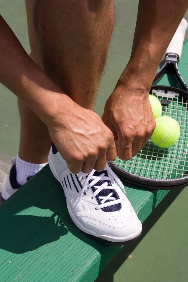 Tennis Player Tying Shoe-Vertical